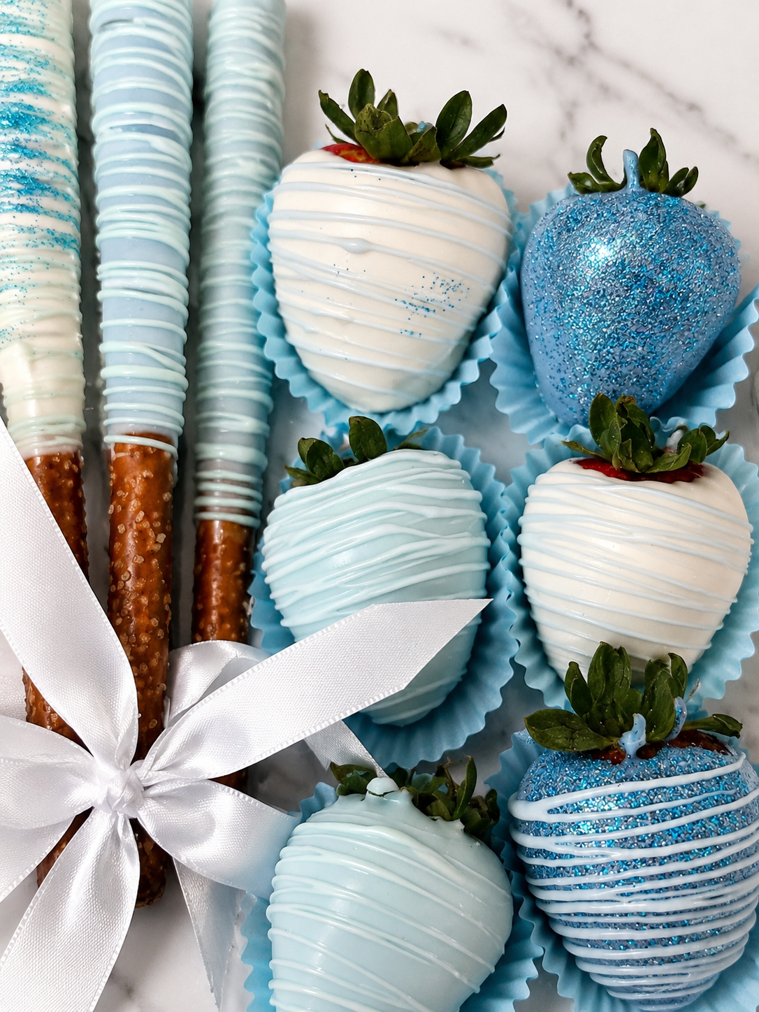 Sparkling blue and white dipped treats by Jazzy Sweets and Treats